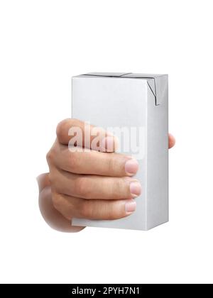 carton of milk or juice package in hand isolated on white background Stock Photo