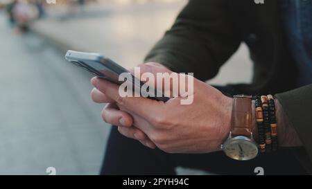 lose-up of man hands using mobile phone Stock Photo