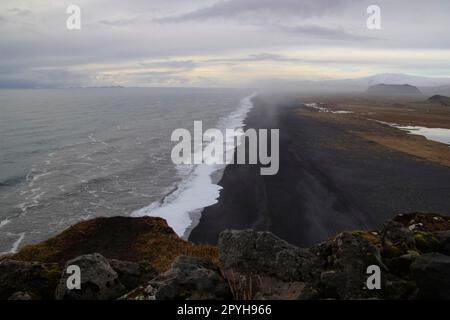 View to endless ocean black volcanic sand beach from Dyrholaey Cape Viewpoint, Vik, South Iceland Stock Photo