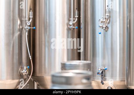 stainless steel tanks for brewing beer in a brewery Stock Photo