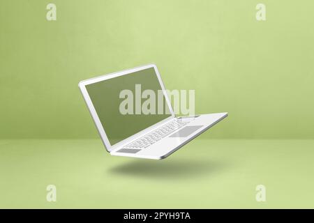 Blank computer laptop floating over a green background. 3D isolated illustration. Horizontal template Stock Photo