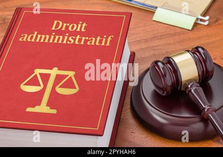 A law book with a gavel - Administrative law in french - Droit administratif Stock Photo