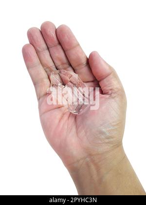 ice cubes on hand. isolated on a white background Stock Photo