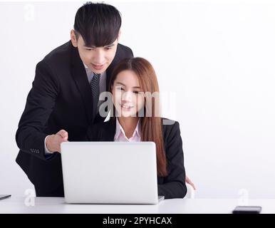 Business  team using laptop and working together in office Stock Photo