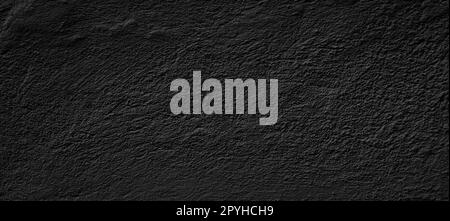 Empty concrete wall covering by plaster and painting in black colour. Stock Photo