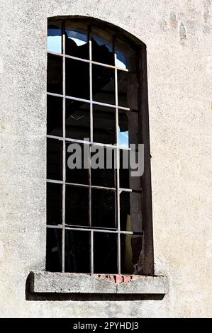 Old window with broken panes Stock Photo