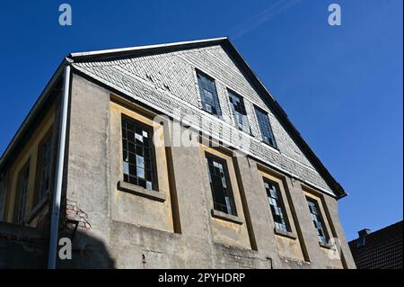 Old facade with broken windows Stock Photo
