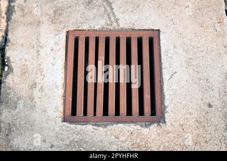 sewerage grid closeup in the city Stock Photo