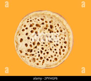 Crumpet isolated on the yellow Stock Photo