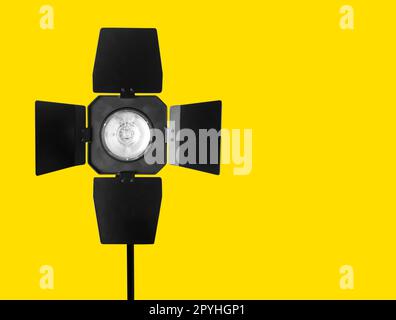 Studio strobe flash on the yellow Stock Photo