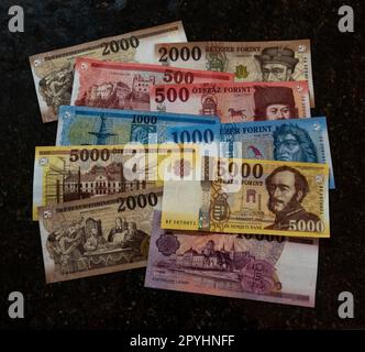 Pile of banknotes of the Hungarian forints. Denominations of 10,000, 5000, 2000, 1000, and 500 forints notes. Issued by the Hungarian National Bank. Stock Photo