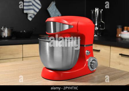 https://l450v.alamy.com/450v/2pyhtxc/modern-stand-mixer-on-wooden-table-in-kitchen-2pyhtxc.jpg
