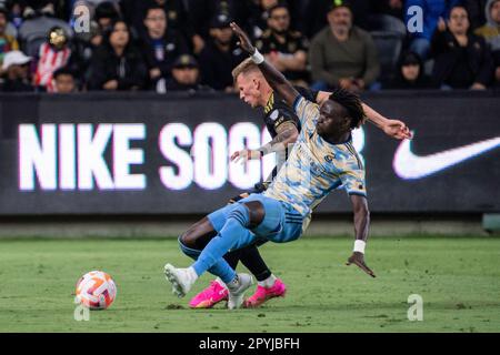 LAFC midfielder Mateusz Bogusz (19) and Philadelphia Union defender Olivier Mbaizo (15) fight for possession during a CONCACAF Champions League semi-f Stock Photo