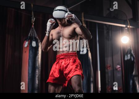 Professional boxer wear virtual reality headsets to engage in immersive boxing workouts simulations while practicing their punching techniques. Live, Stock Photo