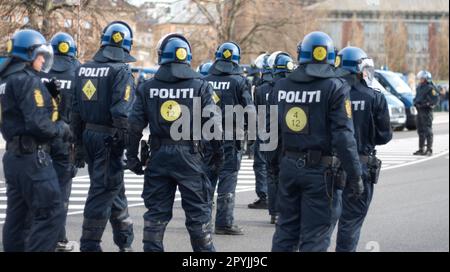 Law, security and back of police in city during a protest or march for protection and public service. Safety, violence and professional guards in Stock Photo
