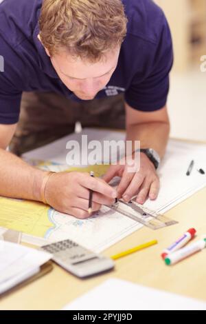Map, man working and sea marine investigation with a drawing and ruler on a table. Sailing strategy, rescue and boat worker with navigation paperwork Stock Photo