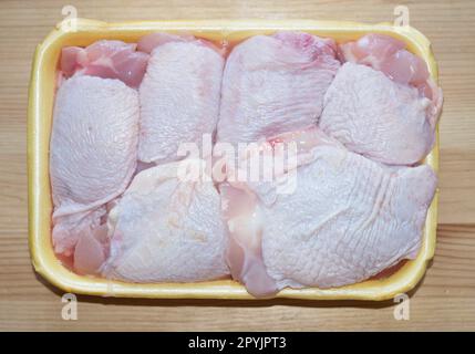 Chicken thighs in a tray. Top view Stock Photo