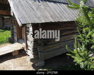 Log village farmhouse. 19th century Bosnian mountain traditional dwelling. Restored ethno building. The old way of village life. House of the witch in the woods Stock Photo