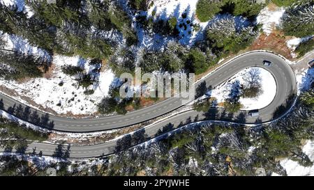 Aerial shot with drone of tight curve with cars at Gaichtpass in Tyrol Stock Photo