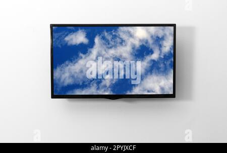 TV monitor with picture on the wall Stock Photo