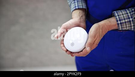 Electrician Holding Smoke Stock Photo