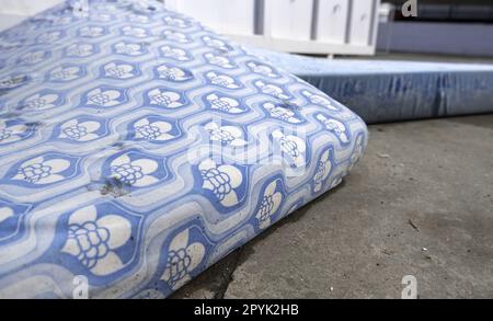 Mattresses in the trash Stock Photo