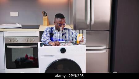Washing Machine Appliance Repair And Install Stock Photo