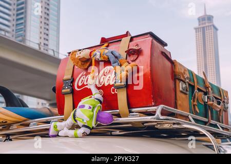 17 January 2023, Dubai, UAE: Toy story figures on a car luggage on the roof Stock Photo