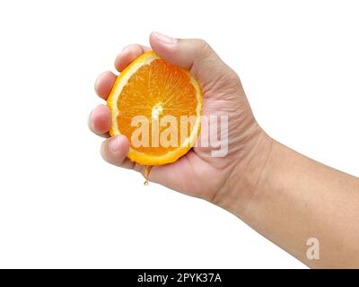 Hand squeezing an orange isolated on white background Stock Photo