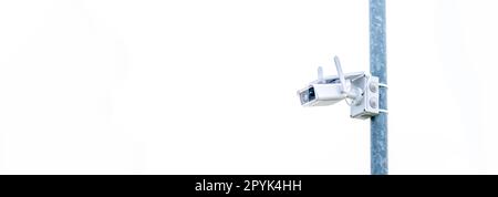 outdoor security camera on a pole. banner with copy space Stock Photo