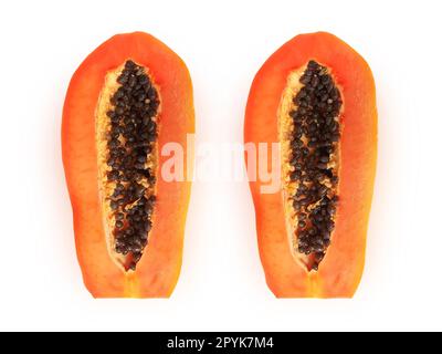half of ripe papaya fruit with seeds isolated on white background Stock Photo