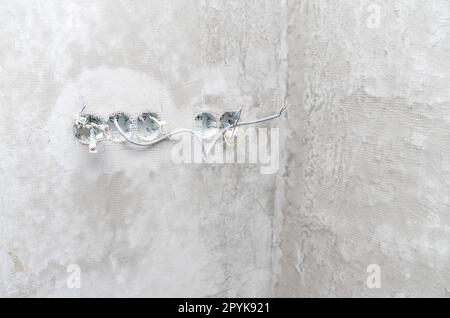 electrical wires in the wall at the construction site Stock Photo