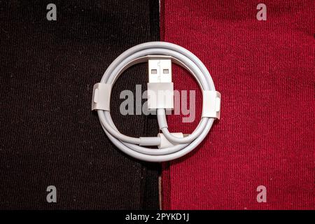 Rolled lightning USB cable Stock Photo