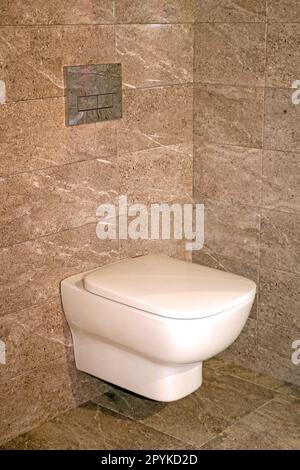 Closed lid toilet inside modern interior Stock Photo