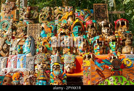 Souvenir wooden carved face masks on sale, Chichen Itzá, Mayan ruins, Yucatan, Mexico Stock Photo
