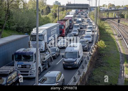 On May 4, 2023, climate protesters blocked the A100 freeway in Berlin as part of a more significant protest to demand action on the climate crisis. The A100 is a major motorway that runs through the city, connecting the western and eastern parts of Berlin. The blockade caused significant traffic disruptions during the morning rush hour, with long delays reported on the freeway and surrounding roads. The A100 has been a contentious issue in Berlin for several years, with many residents and environmental groups opposing plans to expand the motorway. The climate protesters who blocked the A100 fr Stock Photo