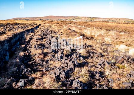 Peat Turf cutting in County Donegal - Ireland. Stock Photo