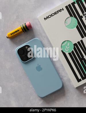 LONDON - APRIL 29, 2023: Apple iPhone 14 Pro in Sky blue silicone case back minimal rear view with logo Stock Photo