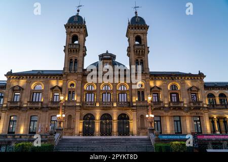 San Sebastian, SPAIN - July 09 2022 Streets of San Sebastian - Donostia. View of Town Hall building at night luminated. Stock Photo