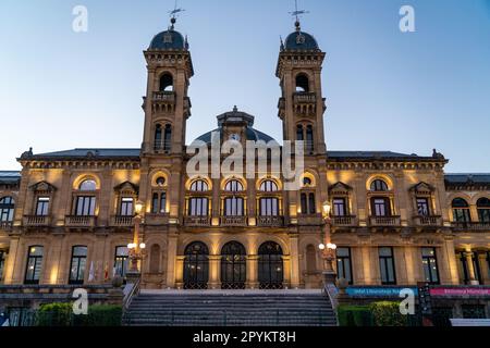 San Sebastian, SPAIN - July 09 2022 Streets of San Sebastian - Donostia. View of Town Hall building at night luminated. Stock Photo