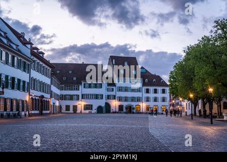 Minster Cathedral Square with old-world architecture at dusk, Basel, Switzerland Stock Photo