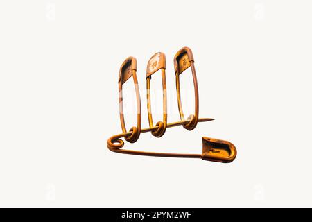 An old and rusty safety pin set isolated on white background Stock Photo