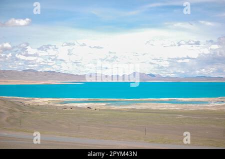 A scenic view of a mountain lake surrounded by desert landscape on a bright sunny day Stock Photo