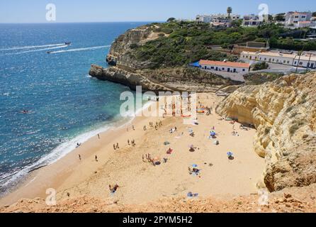 Benagil, Portugal - April 11, 2023: Wonderful landscapes in Portugal. Scenic and coloured view of Praia do Benagil in the Algarve region. Yellow rocky Stock Photo