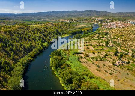 Aerial view of the Flix meander, where the Ebro river forms a huge meander around the castle and village of Flix (Ribera d'Ebre, Tarragona, Spain) Stock Photo