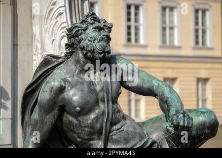 One of the four chained warriors at the base of King Frederic the Great statue Charlottenburg Palace in Berlin Stock Photo