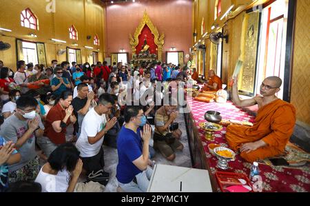 A Buddhist monk is seen blessing the devotees during the Wesak Day ...