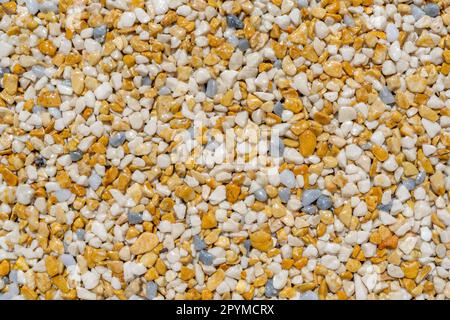 Tiny gravel texture on brown concrete wall. Texture background seamless gravel floor. High quality photo. Stock Photo