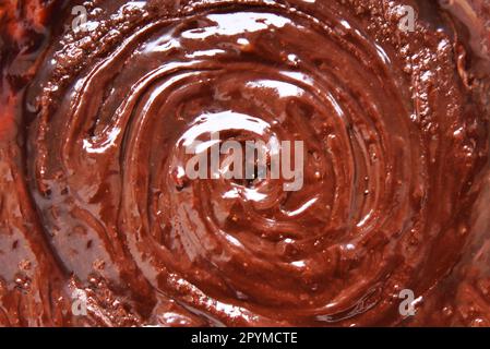 Chocolate swirl background. Chocolate creame. Melted chocolate background Stock Photo