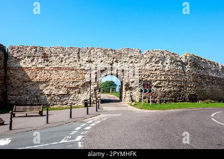 The arched entrance through ancient walls to the Roman Saxon fort of Anderitum on which Pevensey Castle is built Stock Photo